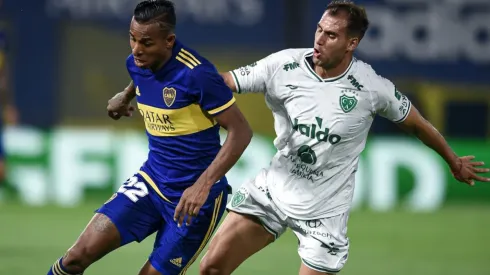 Sebastian Villa of Boca Juniors (left) against Nicolas Bazzana of Sarmiento.