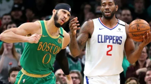 Jayson Tatum of Celtics (left) argues with Kawhi Leonard of Clippers