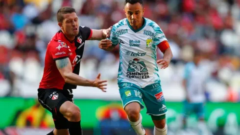 Hugo Nervo of Atlas (left) tries to stop Luis Montes of Leon