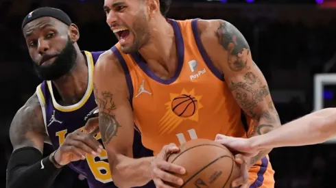 Lebron James of Lakers (left) tries to stop Abdel Nader of Suns
