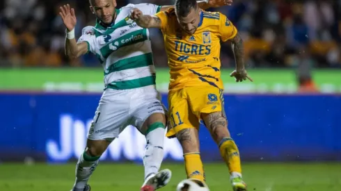 Matheus Doria of Santos (left) fight for ball control against Nicolas Lopez of Tigres
