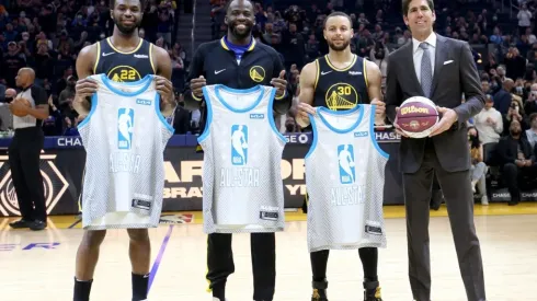 Andrew Wiggins, Draymond Green and Stephen Curry hold their All-Stars jerseys