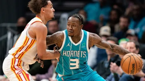 Trae Young of the Atlanta Hawks guards Terry Rozier of the Charlotte Hornets