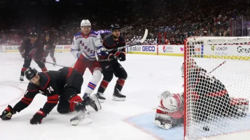 Kaapo Kakko #24 of the New York Rangers watches a first period shot by Filip Chytil #72 (not shown) get past Antti Raanta #32 of the Carolina Hurricanes