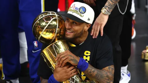 Gary Payton II with the Larry O'Brien trophy as champion