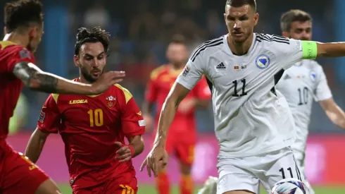 Marko Jankovic of Montenegro and Edin Dzeko of Bosnia and Herzegovina