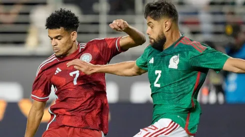 Luis Diaz (Colombia / left) and Nestor Araujo (Mexco / right) fight for a ball during 2022 International Friendly game.
