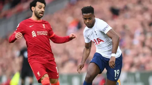 Ryan Sessegnon of Tottenham Hotspur runs with the ball under pressure from Mohamed Salah of Liverpool