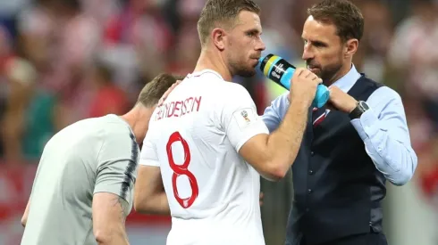 England coach Gareth Southgate talks to Jordan Henderson during a Russia 2018 World Cup game.