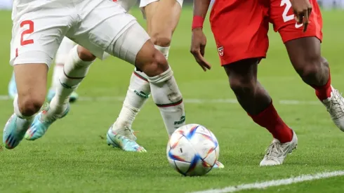 Players fight for the ball at the World Cup