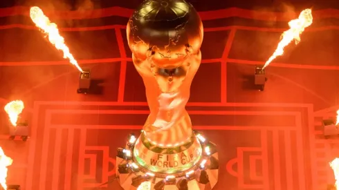 Pyrotechnics explode around a giant FIFA World Cup Trophy