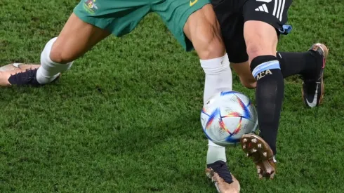 Players fight for the ball at the World Cup