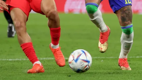 Players fight for the ball at the World Cup