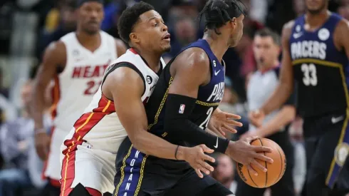 Kyle Lowry of the Miami Heat defends Buddy Hield of the Indiana Pacers