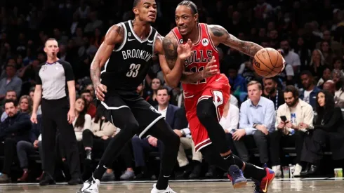 DeMar DeRozan of the Chicago Bulls is defended by Nicolas Claxton of the Brooklyn Nets