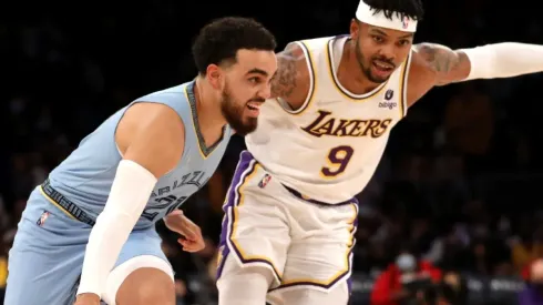 Tyus Jones of the Memphis Grizzlies and Kent Bazemore of the Los Angeles Lakers