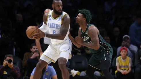 LeBron James #6 of the Los Angeles Lakers post up Marcus Smart #36 of the Boston Celtics