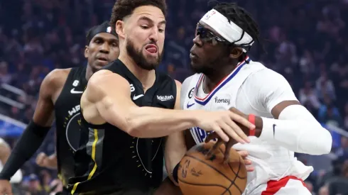Klay Thompson of the Golden State Warriors and Reggie Jackson of the LA Clippers