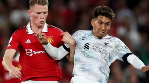 Scott McTominay of Manchester United and Roberto Firmino of Liverpool