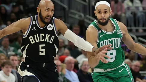 Jevon Carter of the Milwaukee Bucks and Derrick White of the Boston Celtics