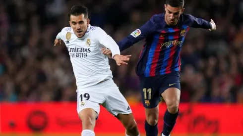 Dani Ceballos of Real Madrid battles for possession with Ferran Torres of FC Barcelona