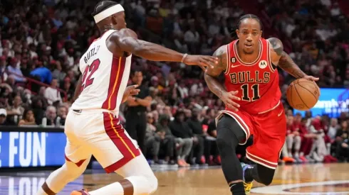 DeMar DeRozan #11 of the Chicago Bulls drives against Jimmy Butler #22 of the Miami Heat.