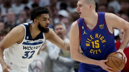 Karl-Anthony Towns of the Minnesota Timberwolves and Nikola Jokic of the Denver Nuggets
