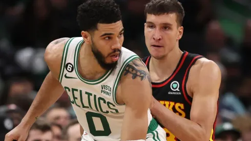 Jayson Tatum of the Boston Celtics and Bogdan Bogdanovic of the Atlanta Hawks