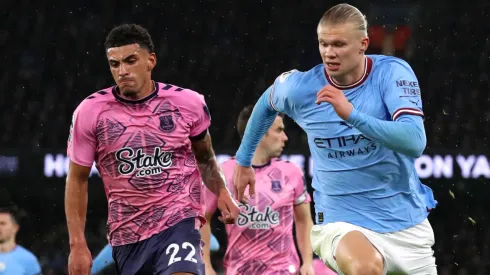 Ben Godfrey of Everton and Erling Haaland of Manchester City