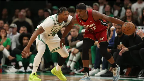 Jimmy Butler #22 of the Miami Heat is guarded by Marcus Smart #36 of the Boston Celtics
