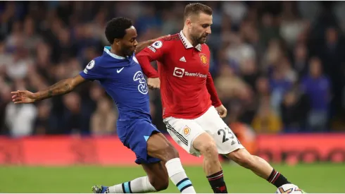 Luke Shaw of Manchester United battles for possession with Raheem Sterling of Chelsea