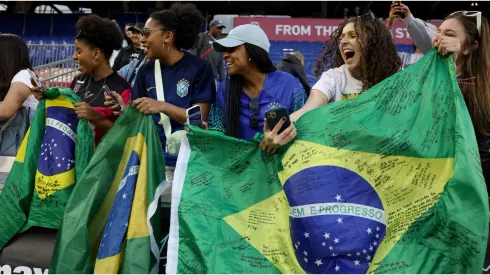 Fans hold Brazil flags