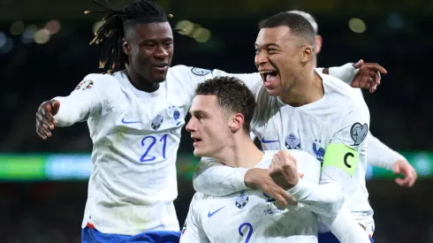 Eduardo Camavinga, Benjamin Pavard, and Kylian Mbappe of France