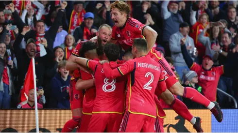 Klauss #9 and Tim Parker #26 of St. Louis City celebrate with teammates