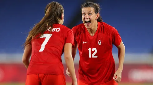 Christine Sinclair #12 of Team Canada celebrates with Julia Grosso #7