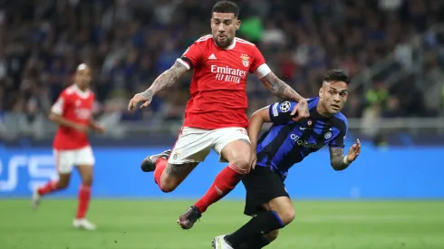 Lautaro Martinez of FC Internazionale battles for possession with Nicolas Otamendi of SL Benfica