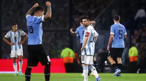 Lionel Messi of Argentina looks dejected as players of Uruguay celebrate.