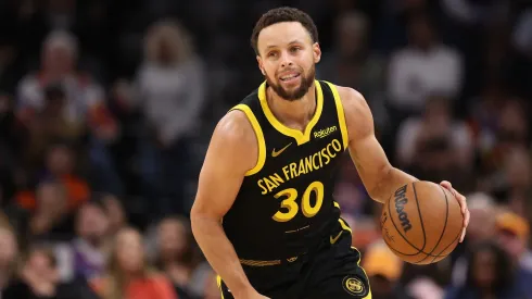 Stephen Curry dribbling the basketball.