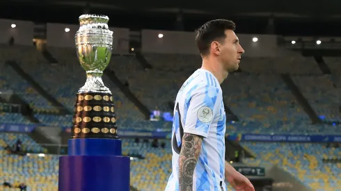 Lionel Messi of Argentina enters the pitch as he passes next to the trophy prior to the final of Copa America Brazil 2021 between Brazil and Argentina at Maracana Stadium on July 10, 2021 in Rio de Janeiro, Brazil.
