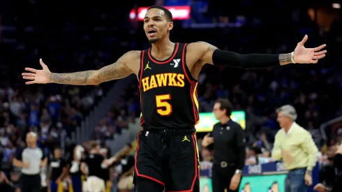 Dejounte Murray of the Atlanta Hawks complains to the referees.