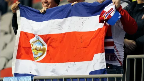 Costa Rican fans hold their contry's flag