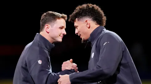 Brock Purdy of the San Francisco 49ers (L) and Patrick Mahomes of the Kansas City Chiefs meet on stage during Super Bowl LVIII Opening Night at Allegiant Stadium on February 05, 2024 in Las Vegas, Nevada.