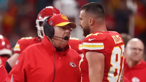 Head coach Andy Reid of the Kansas City Chiefs speaks with Travis Kelce #87 during the NFL match between Miami Dolphins and Kansas City Chiefs at Deutsche Bank Park on November 05, 2023 in Frankfurt am Main, Germany.