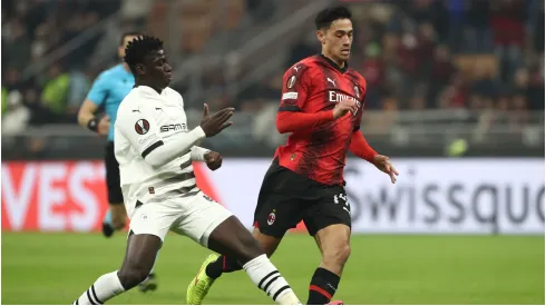 Tijjani Reijnders of AC Milan is tackled by Mahamadou Nagida of Stade Rennais