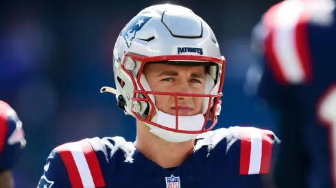 Mac Jones looks on during a game in 2023.