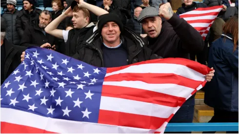 Fans display a USA flag
