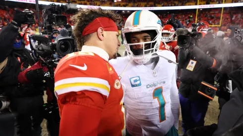 Patrick Mahomes #15 of the Kansas City Chiefs greets Tua Tagovailoa #1 of the Miami Dolphins after the Chiefs defeated the Dolphins 26-7 in the AFC Wild Card Playoffs at GEHA Field at Arrowhead Stadium on January 13, 2024 in Kansas City, Missouri.