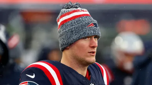 Mac Jones #10 of the New England Patriots looks on after a game against the New York Jets at Gillette Stadium on January 07, 2024 in Foxborough, Massachusetts.