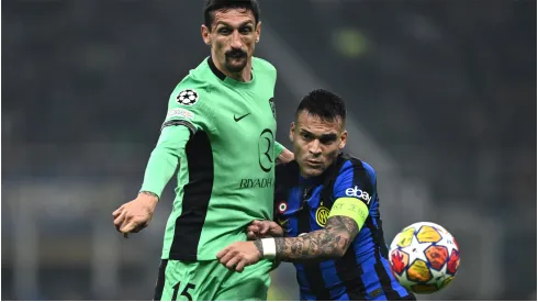 Stefan Savic of Atletico Madrid and Lautaro Martinez of Inter