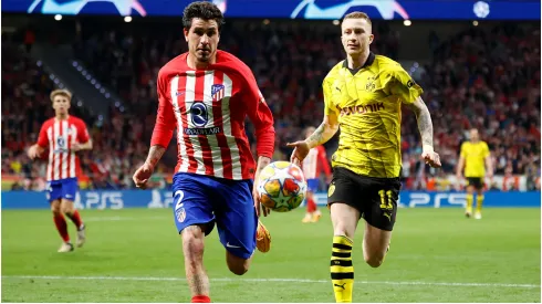 Jose Gimenez of Atletico de Madrid and Marco Reus of Borussia<br />
Dortmund